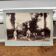 Photo album mounted on cardboard depicting harvesters.