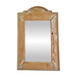 Antique mirror in raw wood with a patina and pediment.