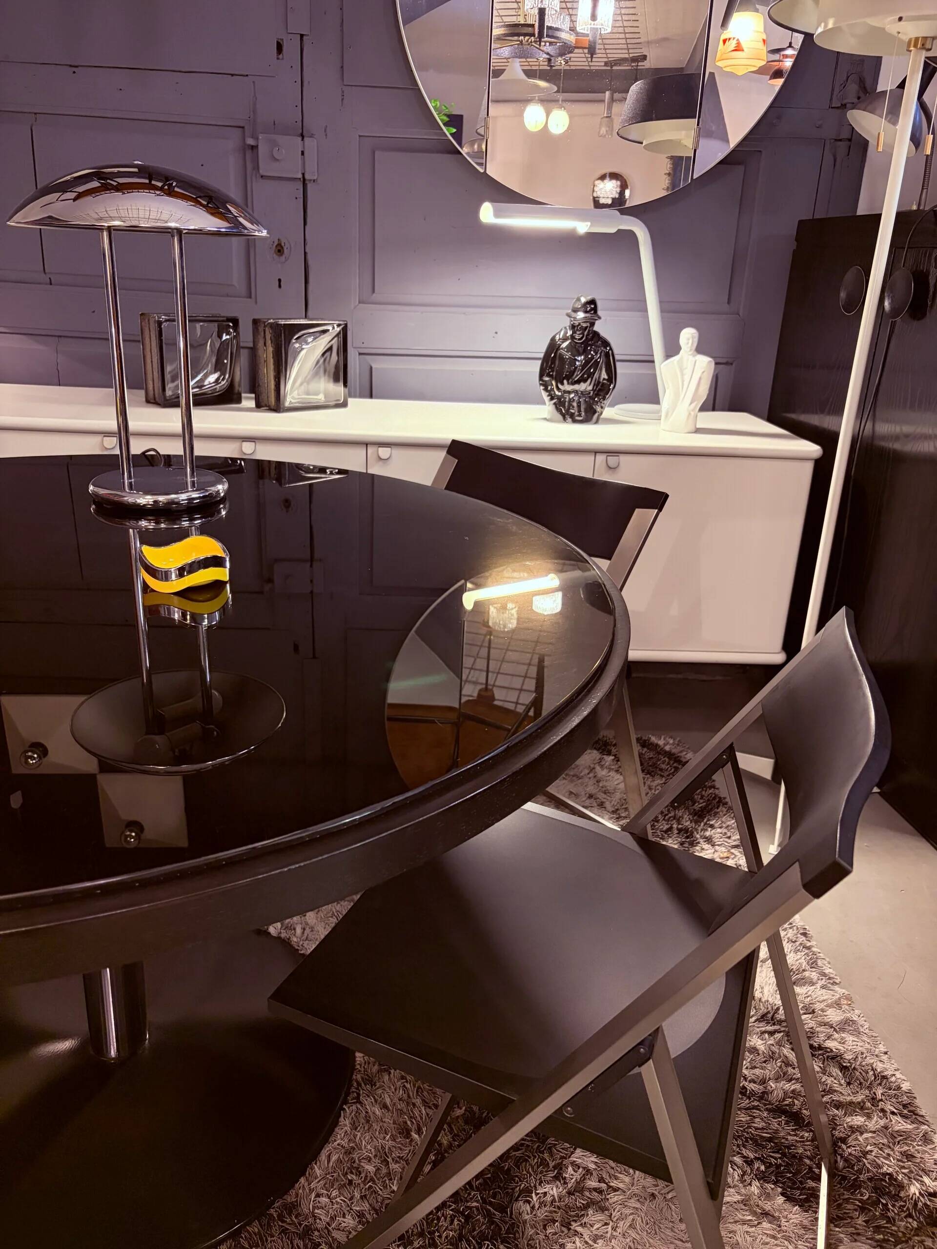Round dining table, 1980s, black stained wood with glass top