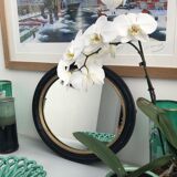 black and gold oval mirror