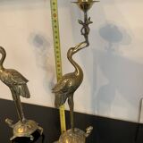 Pair of chiseled and gilded bronze candlesticks depicting perched waders
