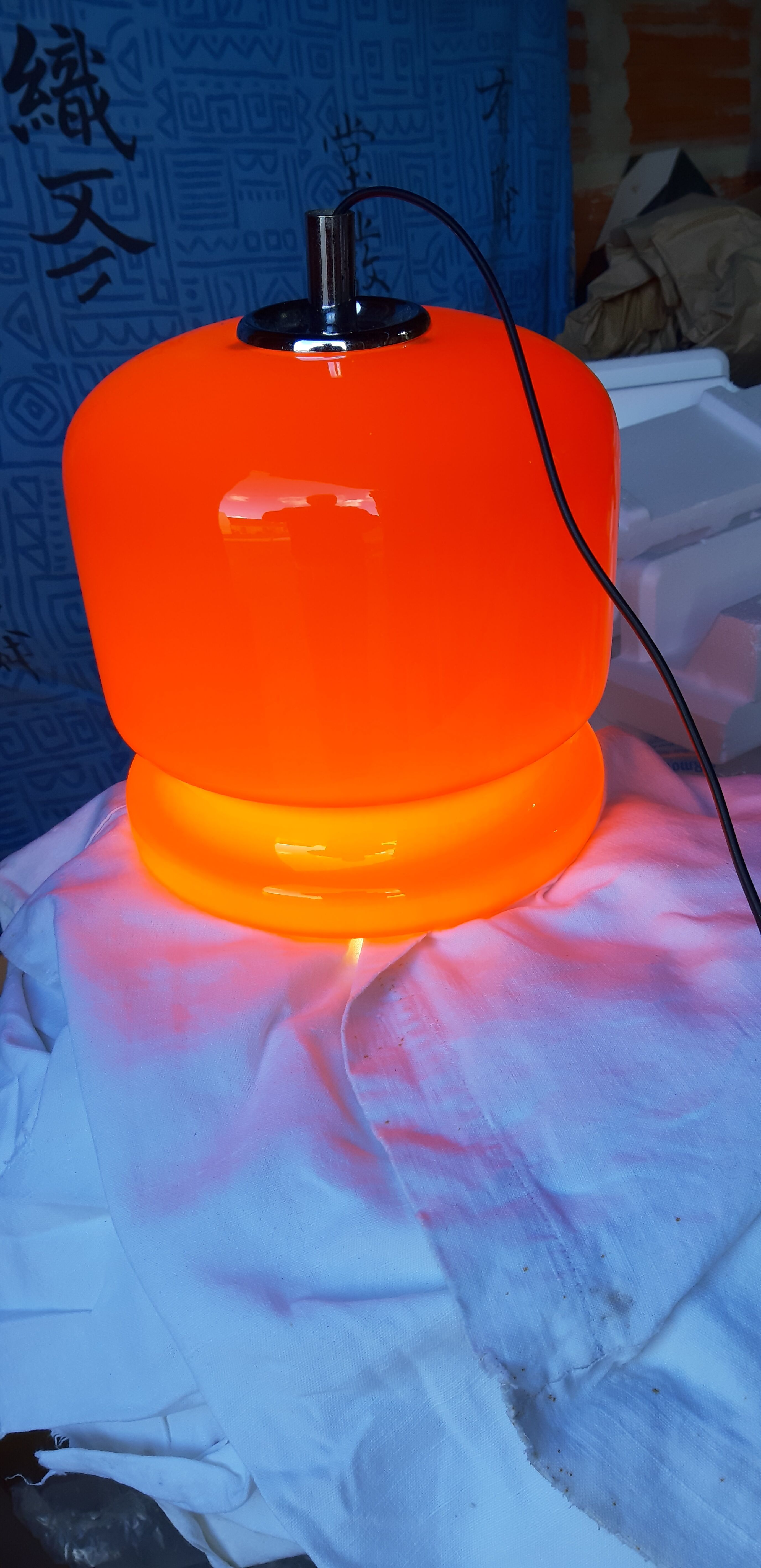 Vintage lamp of the 70s in orange opaline