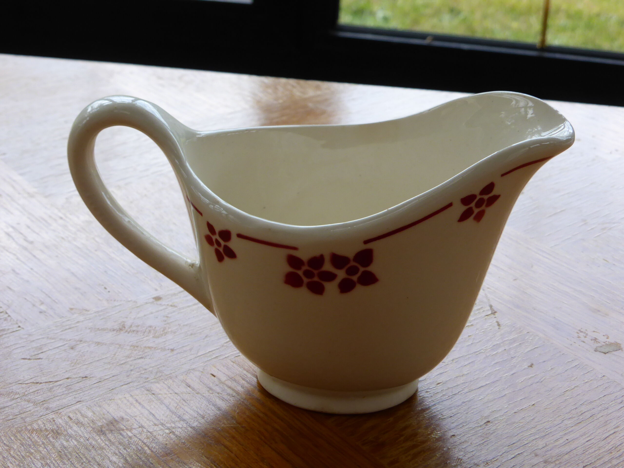 Sauciere in faience with red flowers, KG Luneville, France, Art Deco
