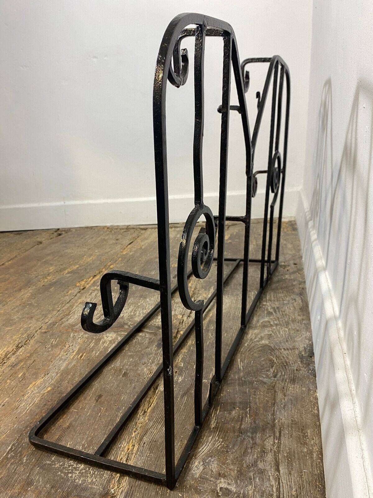 Wall-mounted coat rack in wrought iron, early 20th century