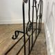 Wall-mounted coat rack in wrought iron, early 20th century