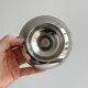 Small silver-plated metal bowl on a stand.