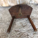 Old vintage wooden tripod milking stool