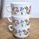 Set of 3 vintage Arcopal coffee cups in opaline with floral decoration.