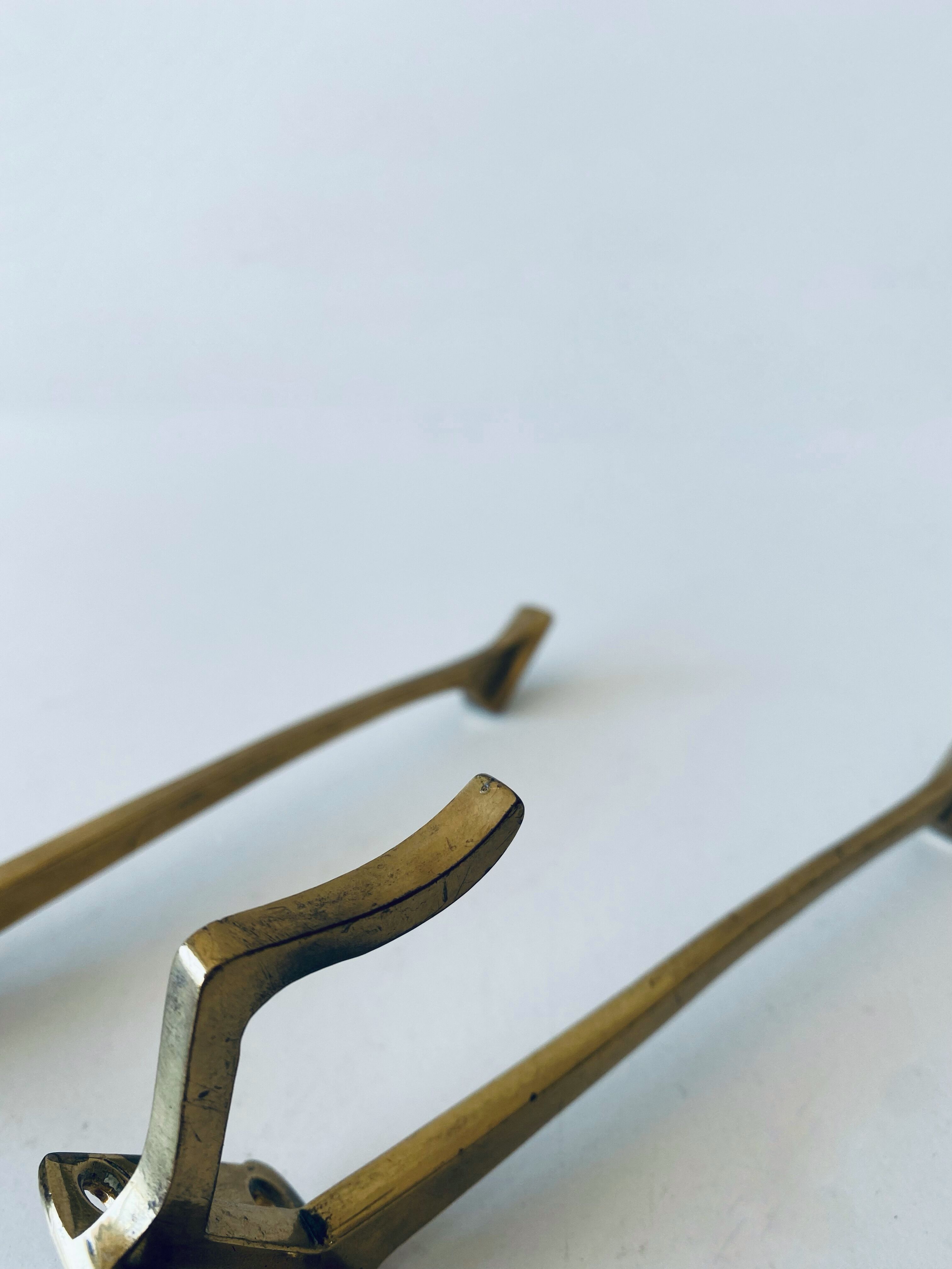 Pair of vintage brass hooks