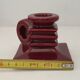 Pair of art deco candlesticks in bordeaux ceramics