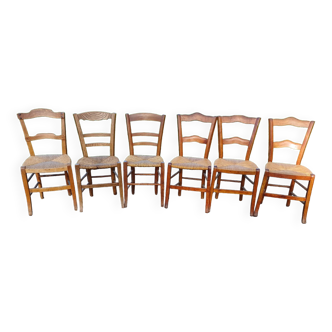 6 old and mismatched straw chairs