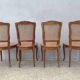 4 caned wooden chairs