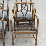 Set of 4 vintage McGuire rattan chairs with cushions.