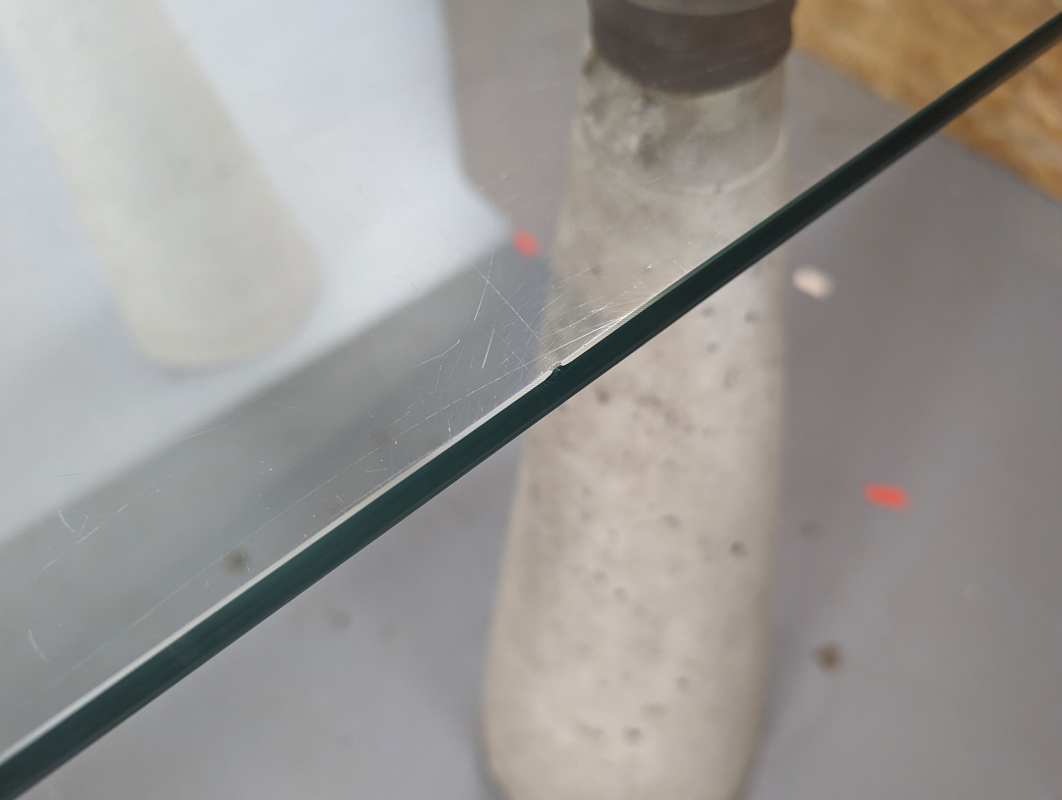 Glass table with cement legs