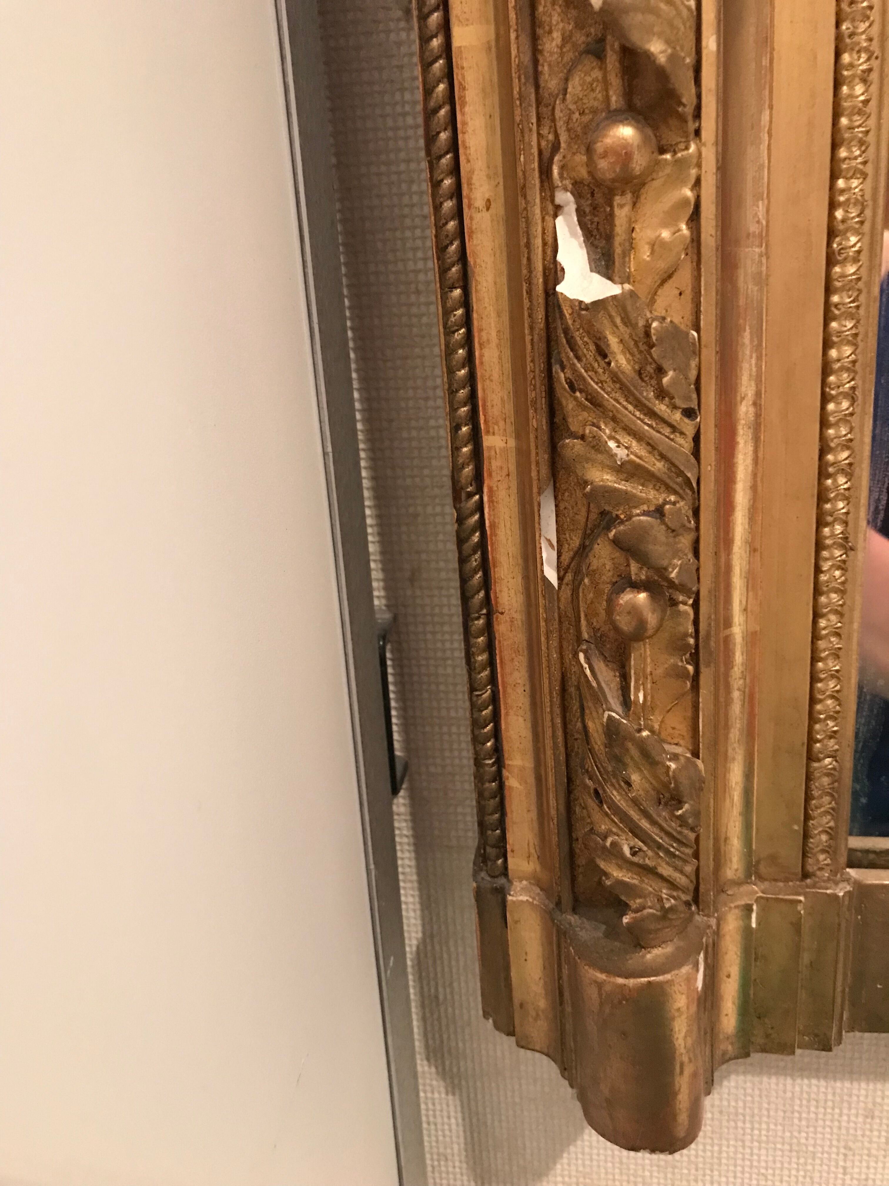 Large antique mirror with flagship shell in wood and gilded stucco