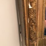 Large antique mirror with flagship shell in wood and gilded stucco