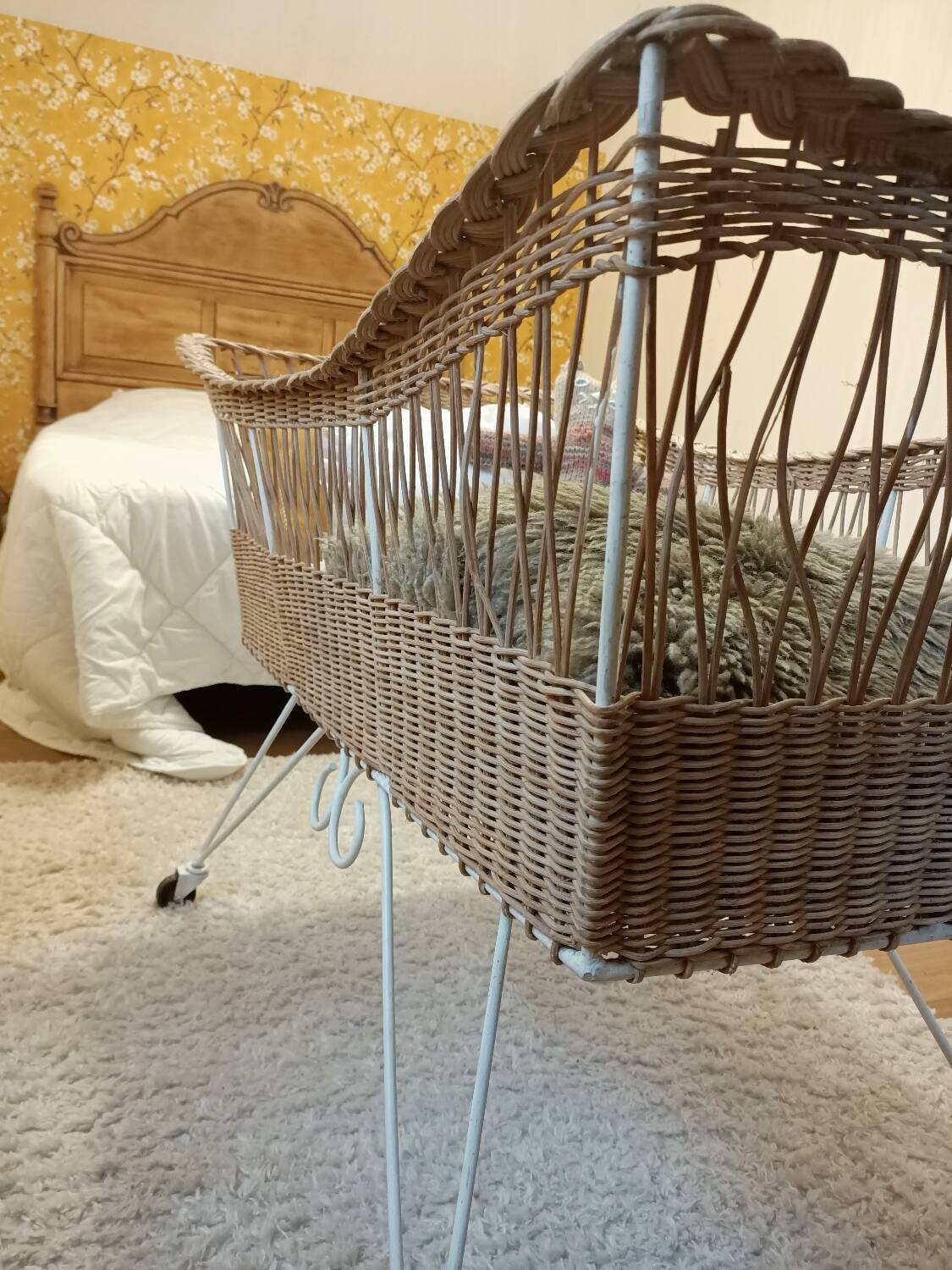 Rattan and wrought iron cradle