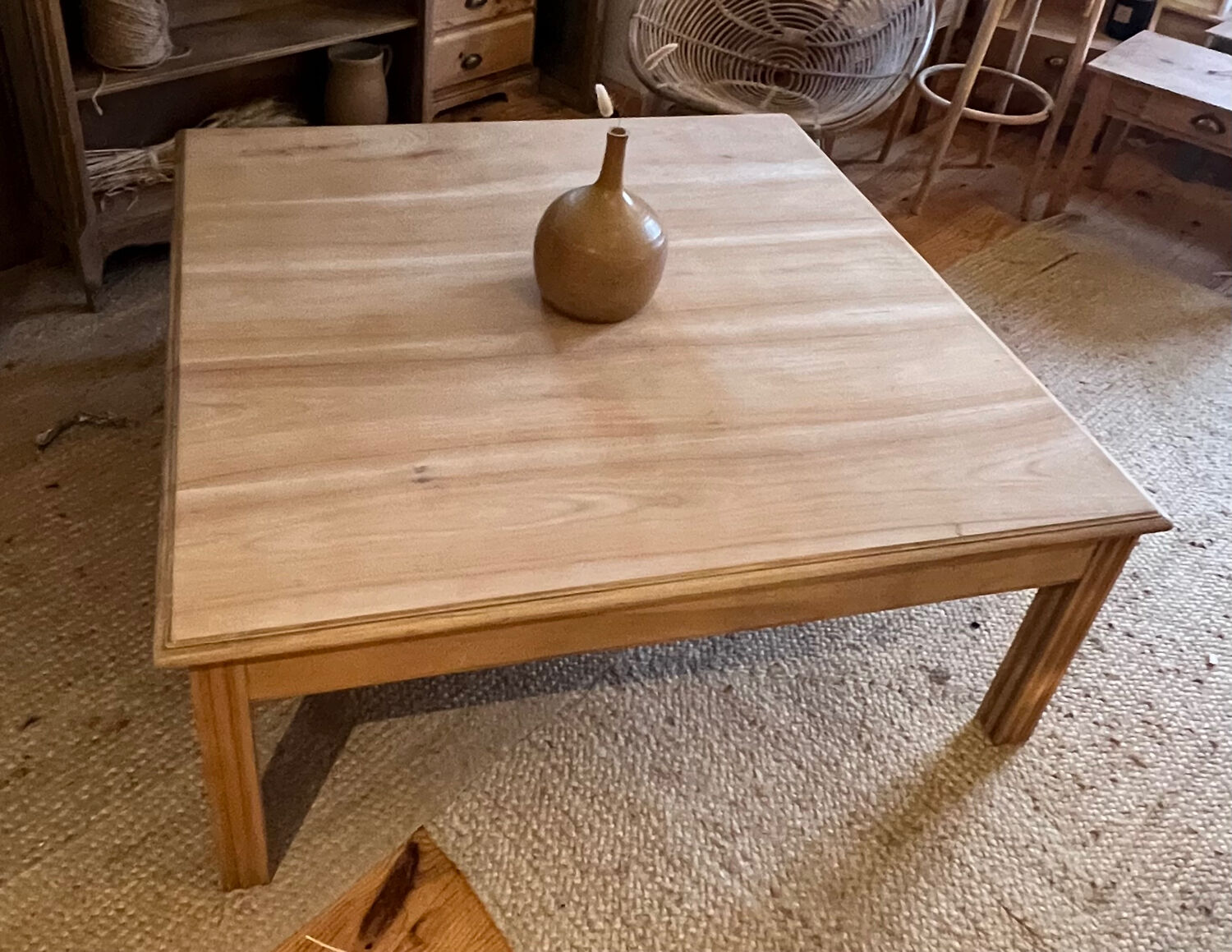 Large square antique coffee table made of raw solid wood.