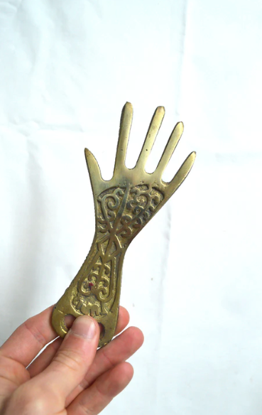 Brass hand bottle opener