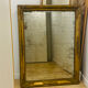 Antique mercury mirror with an Empire gold frame.