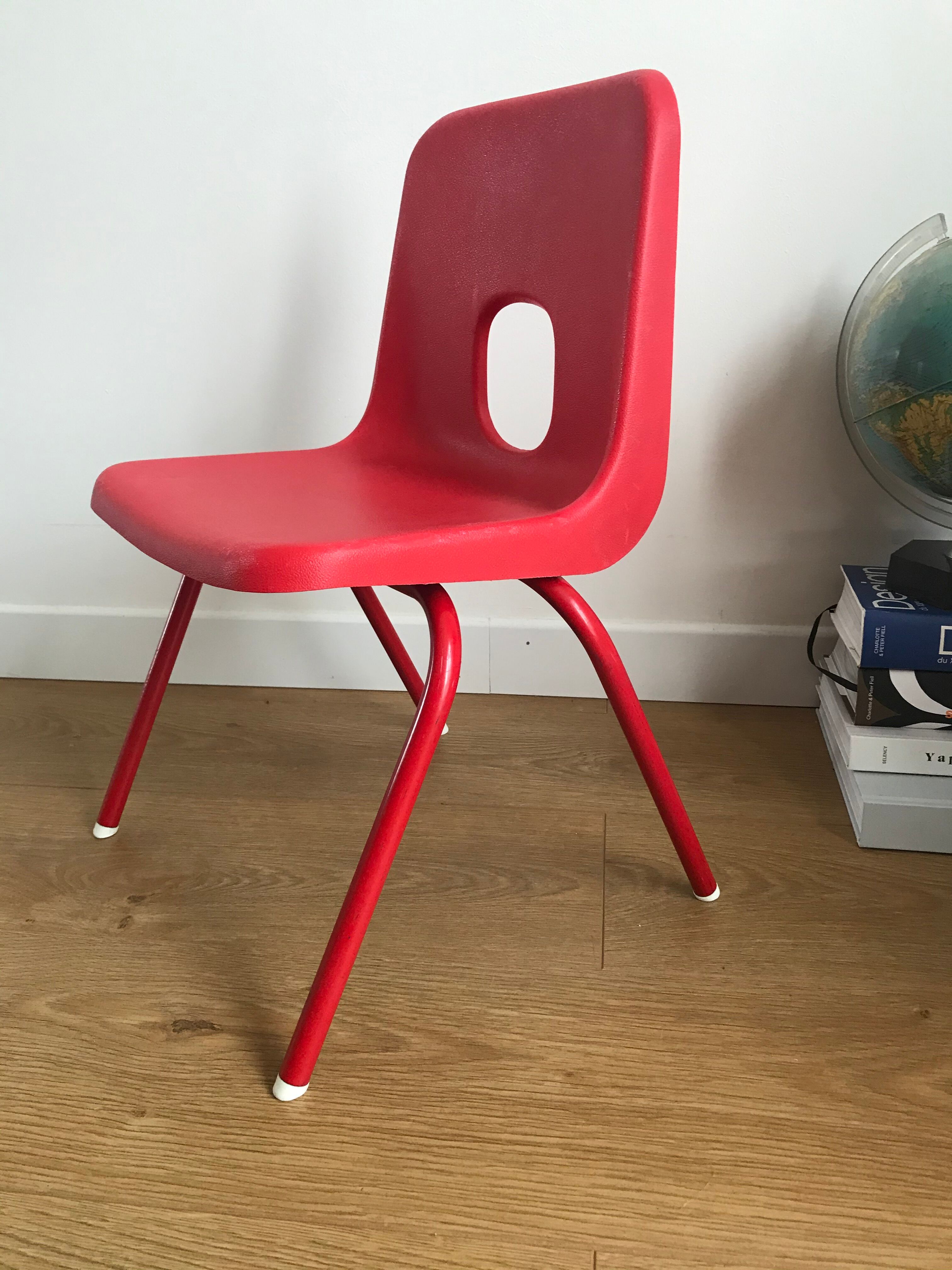 Red child chair by robin day for ikea