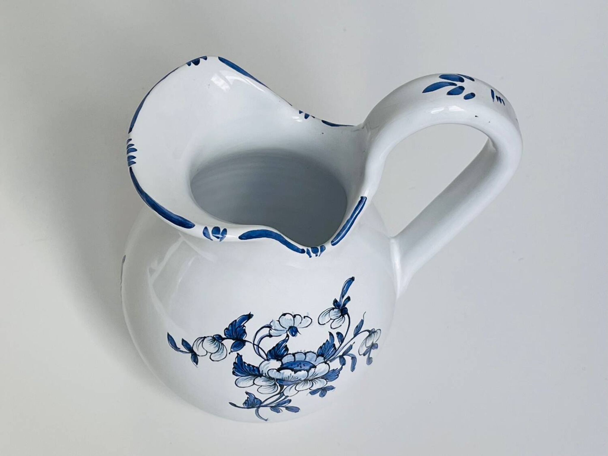 Moustiers pitcher with blue floral decoration
