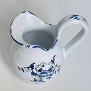 Moustiers pitcher with blue floral decoration