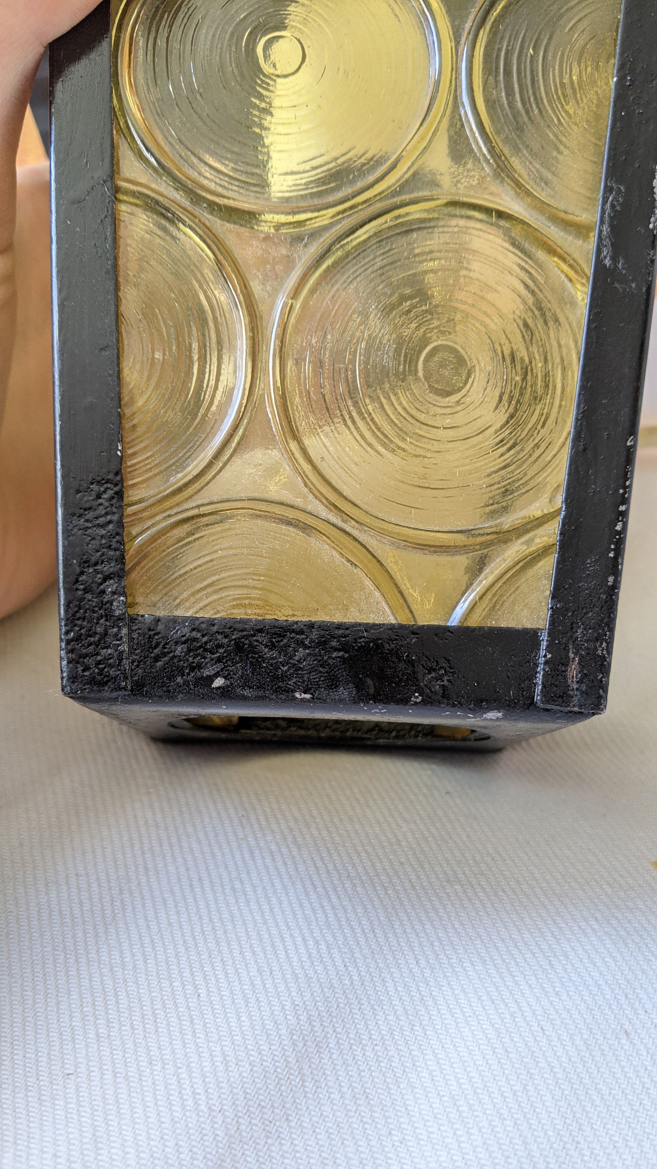 Pretty iron and glass lantern In very good condition black iron color of yellow glass relief circ