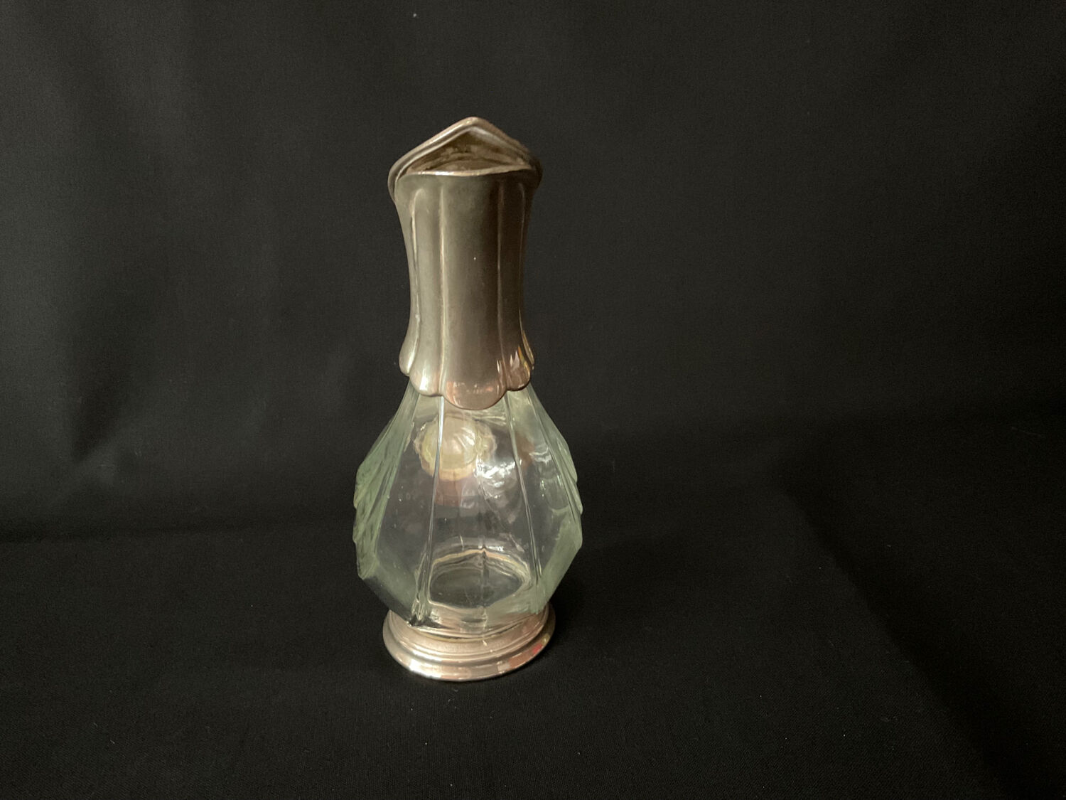 Glass decanter and silver metal duck