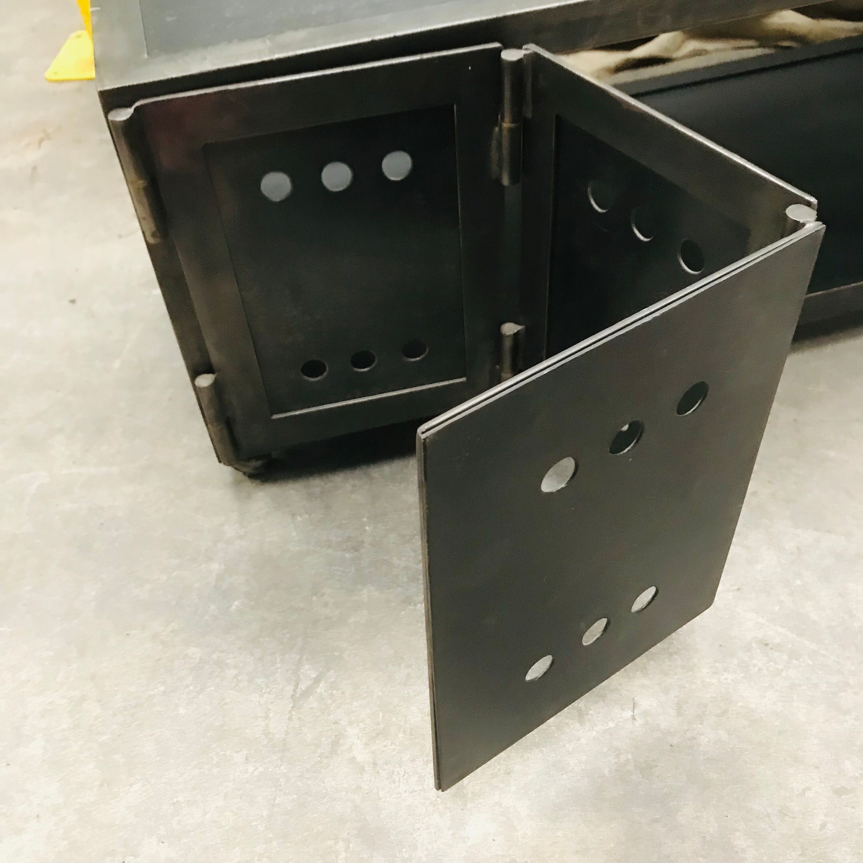 TV stand with natural steel accordion doors