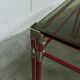 Postmodern Italian design coffee table in smoked glass with red steel structure