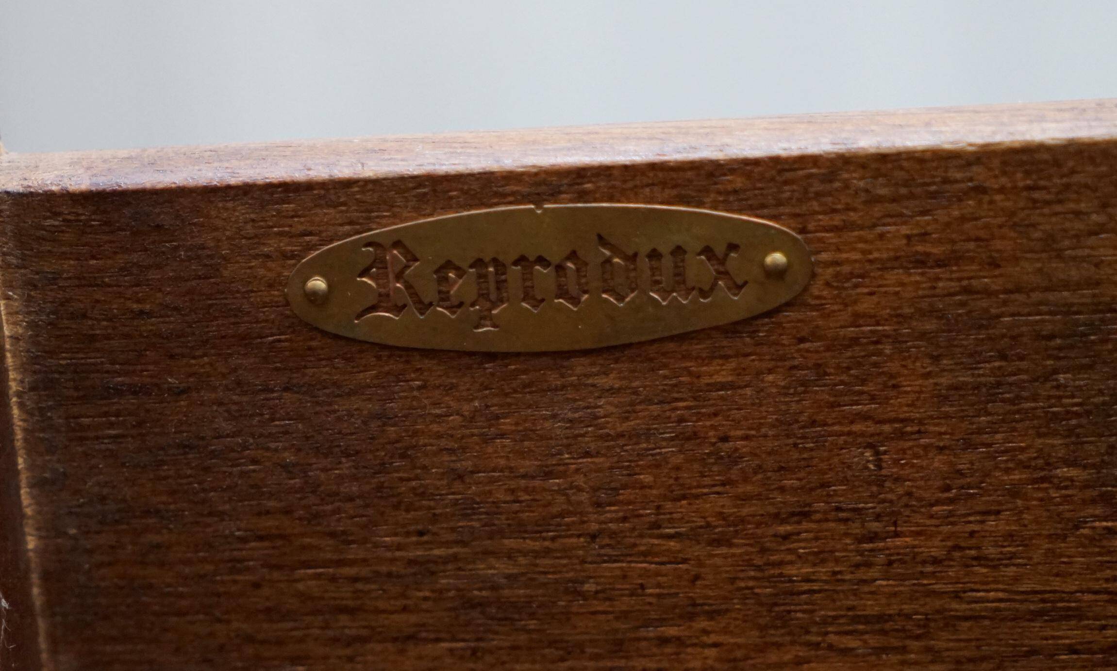 Reprodux Bevan Funnell chest of drawers with a leather top