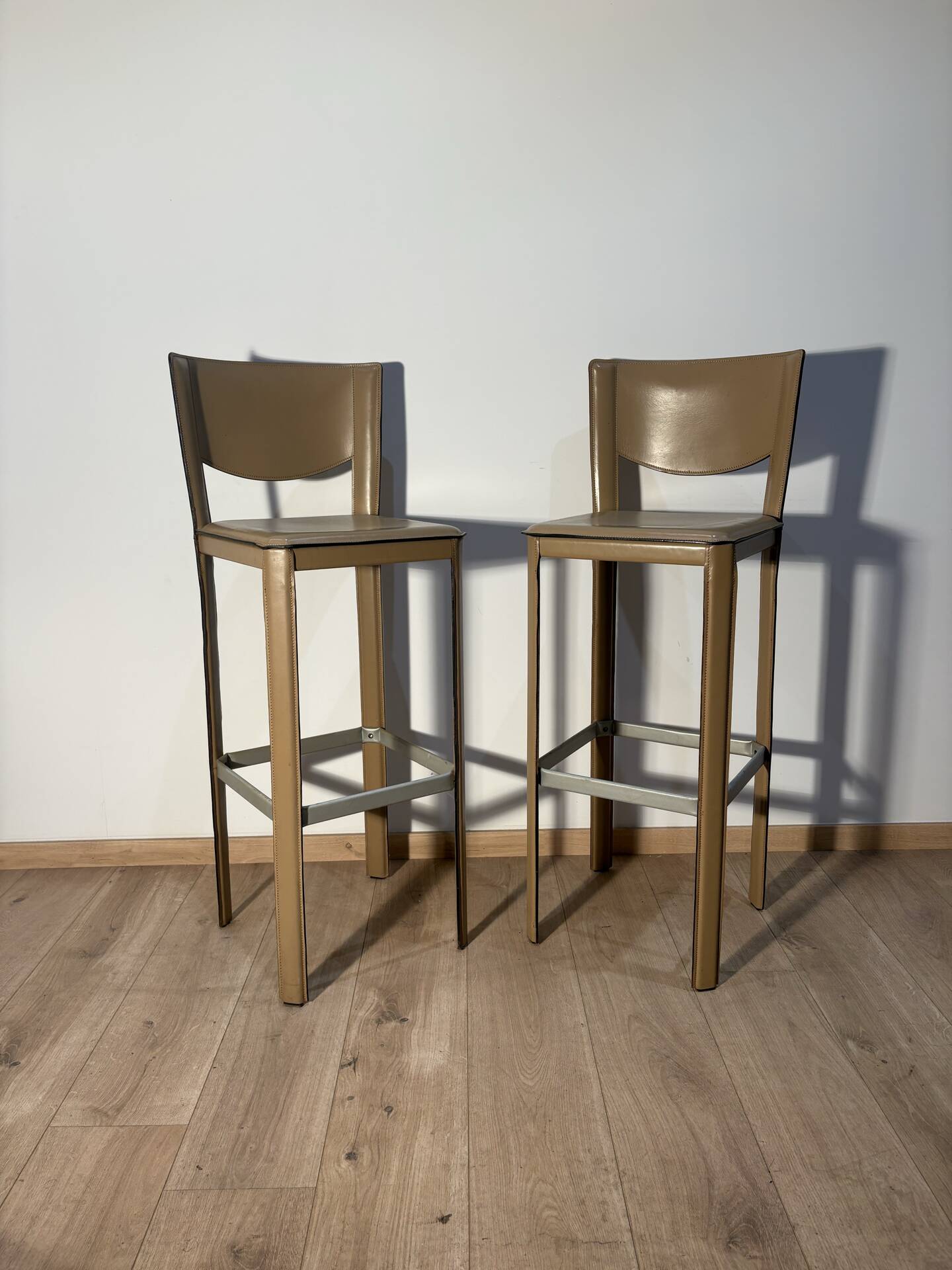 Pair of leather stools Enrico Pellizoni