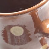 Stoneware pitcher.