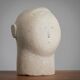 Modernist sculpted male bust in sandstone
