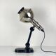 Directional articulated lamp in nickel-plated chrome and black bakelite, with cast iron counterweight.