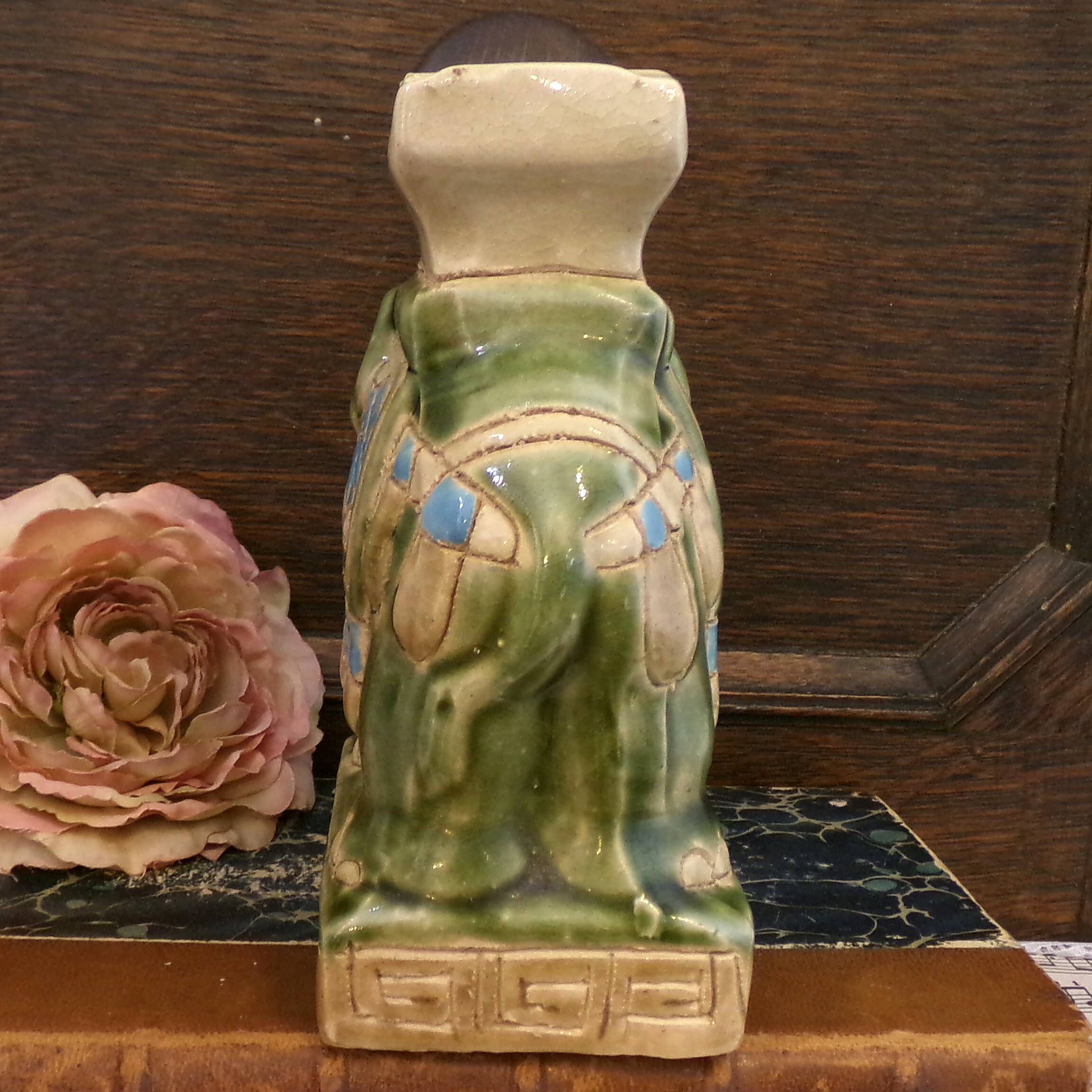 Small green ceramic elephant vase