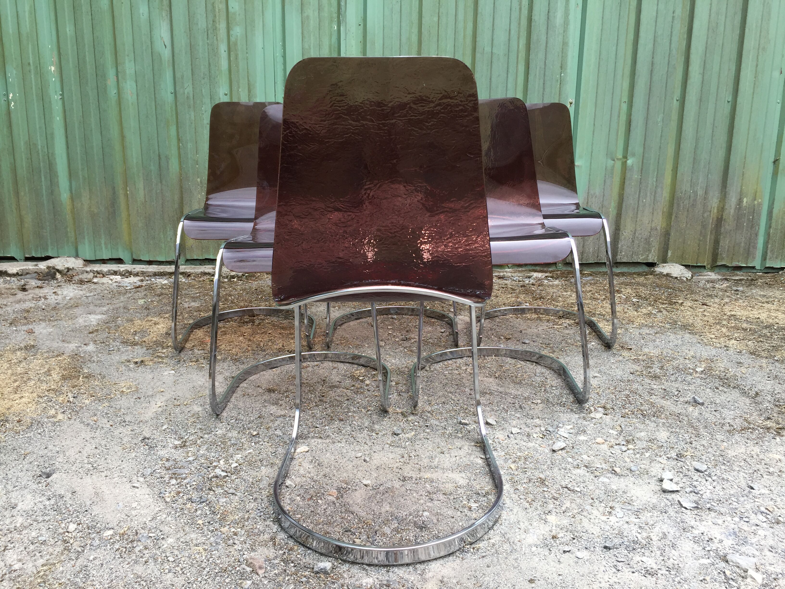 Chairs in plexiglas with chrome metal base