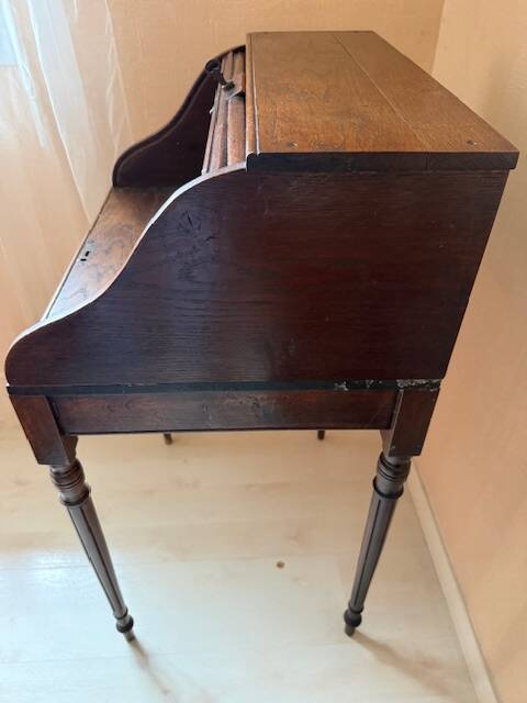 Pretty little secretary with a curtain.