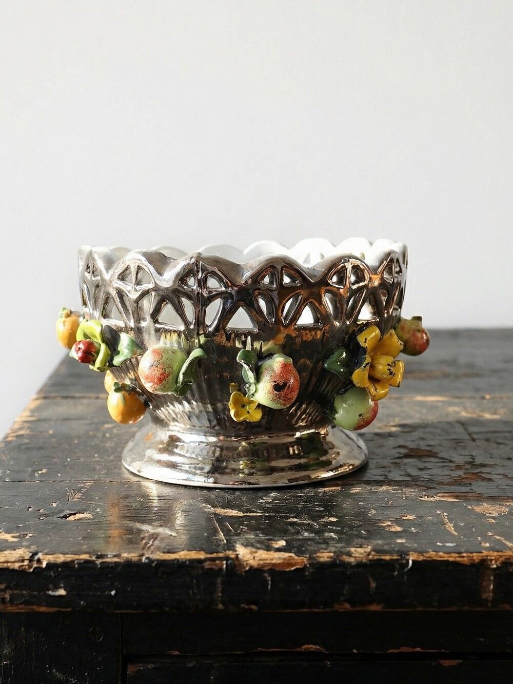 Vintage Italian silver-plated porcelain bowl with cut-out design of fruits and flowers.