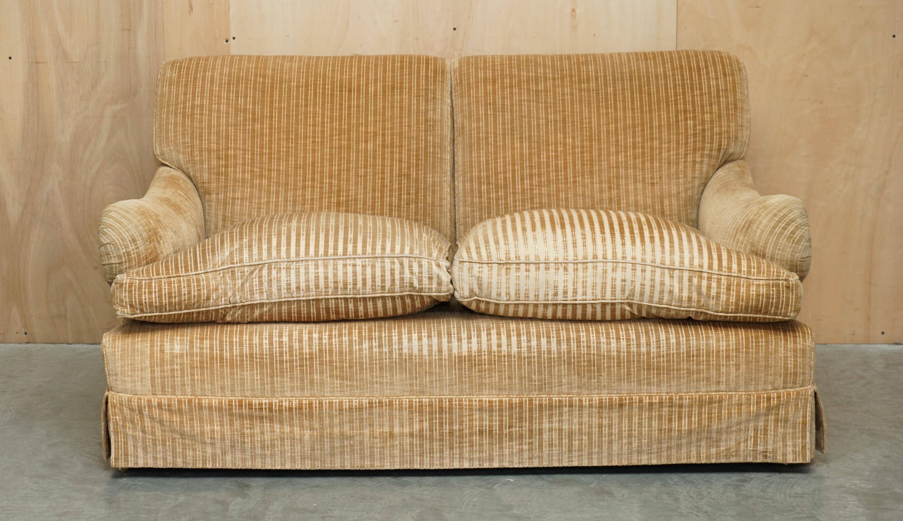 Howard & Sons / Chairs Ltd two-seater canapé with feather-filled cushions.