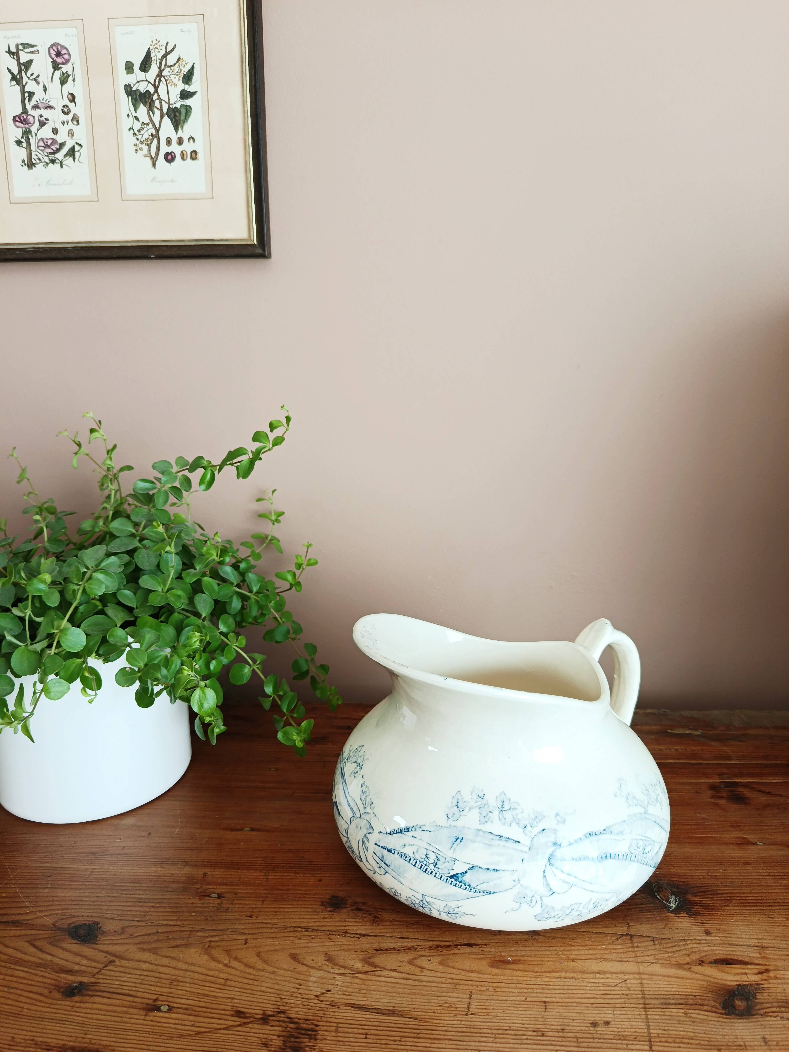 Old bulbous jug in ironstone earthenware