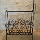 1970s black wrought iron ironing board with enamelled tiles