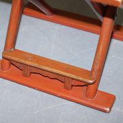 Antique Chinese folding chair with carvings, circa 1900-1920.
