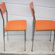 Paire de chaises métal chromé et skaï orange