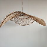 Rattan suspension or lighting fixture in the shape of an undulating circular tray with lattices
