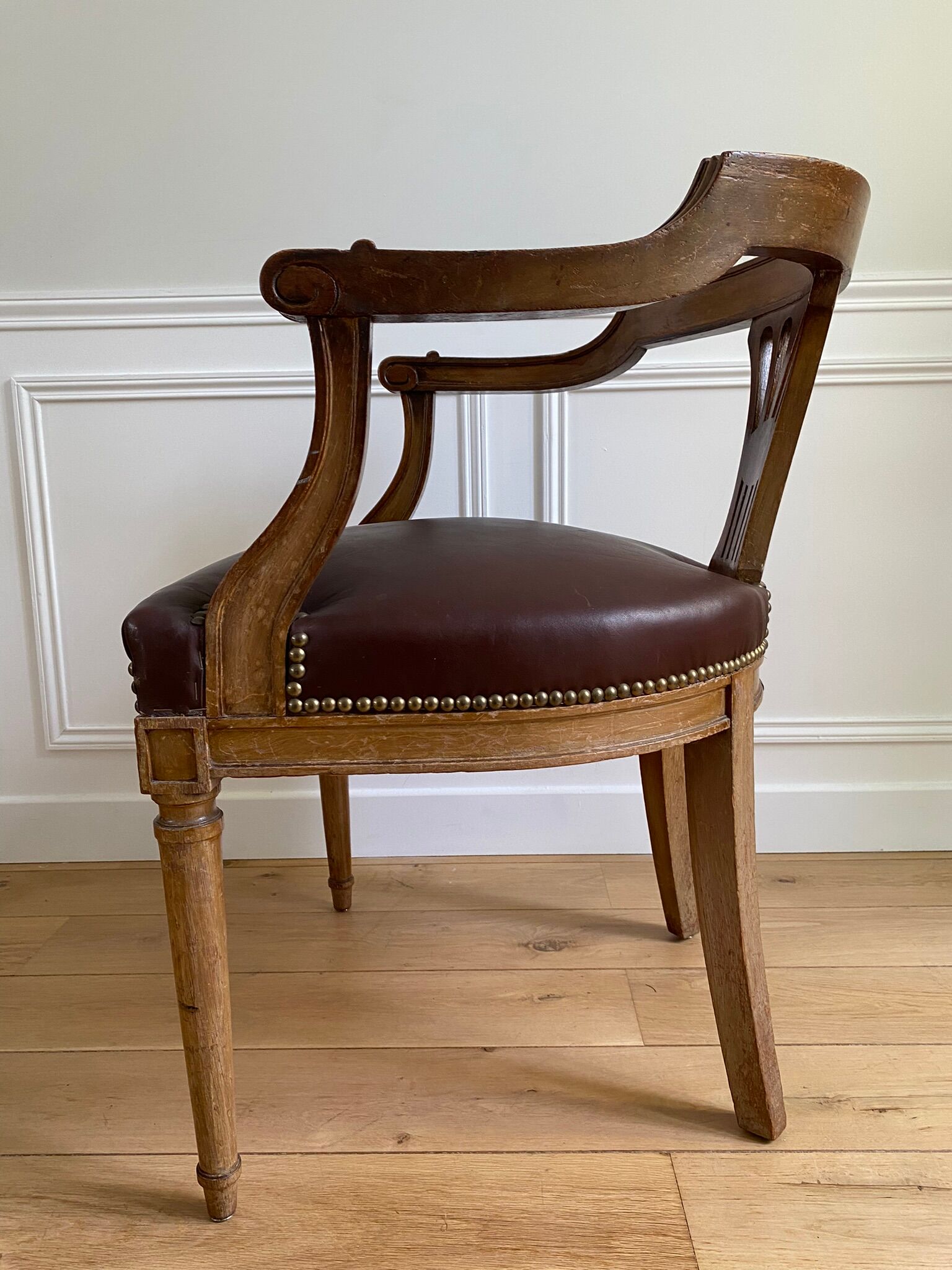 Vintage office chair in wood and brown studded leather late nineteenth