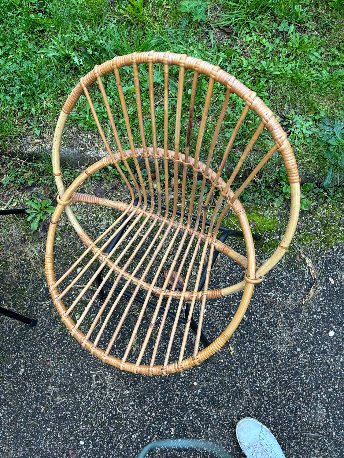 Vintage rattan armchair with metal legs