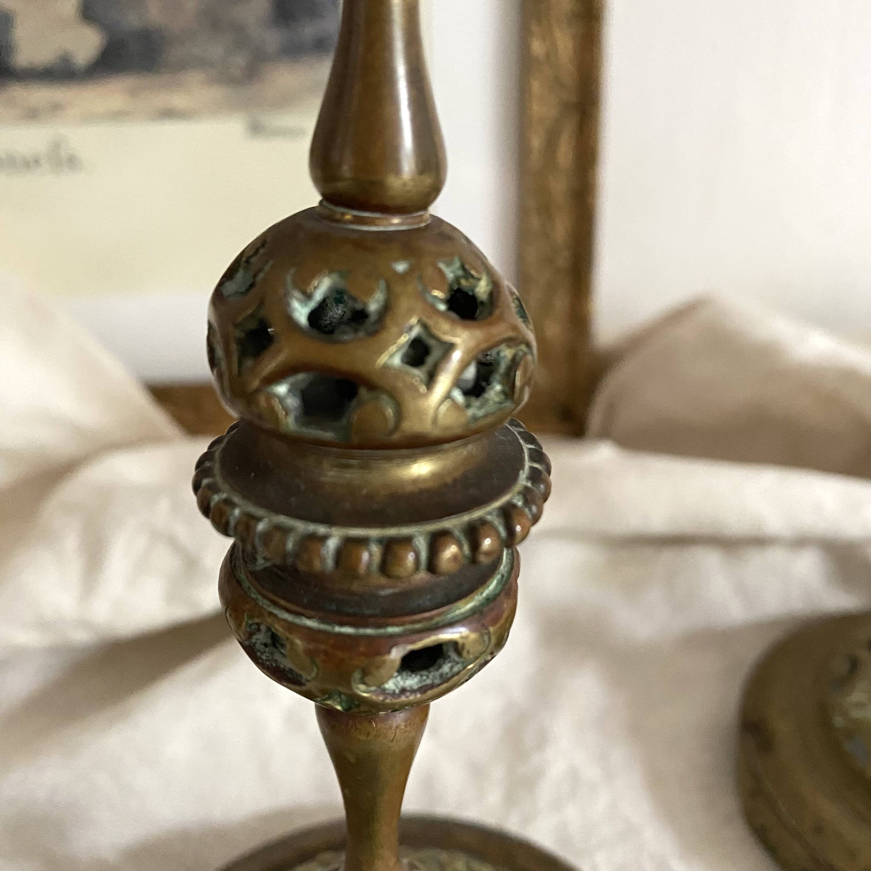 Pair of openwork brass candlesticks and glass bobeches