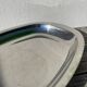 Oval stainless steel dish signed Rémi Letang